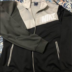 Light Nike athletic jacket.